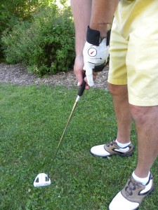 Putt with a locked wrist for a square impact and straight follow through.