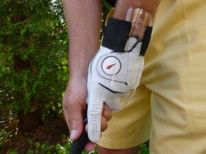 Lock your hands by extending your first finger over the knuckles of your lower hand.