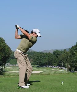 Rory has a perfect flat wrist position as he lets momentum shift his hips slightly up his target line. He lets his club do the work to whip through impact with his ball.